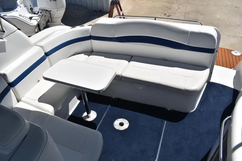 Slide: The Image of 2005 Formula 37 PC boat interior with white and blue seating and table. - 8