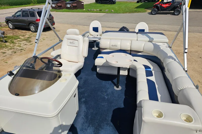Slide: The Image of 2004 Misty Harbor 2285CF pontoon boat with spacious seating and steering console. - 5