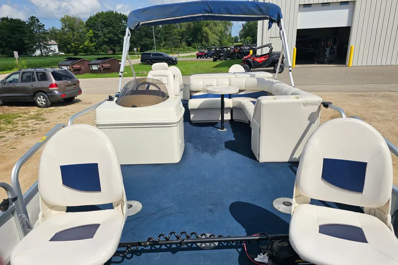 Slide: The Image of 2004 Misty Harbor 2285CF pontoon boat with blue carpet and white seating. - 8