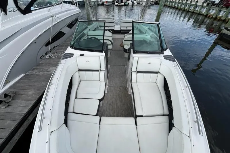 Slide: The Image of 2015 Regal 2800 Bowrider boat with spacious seating, docked at marina. - 11