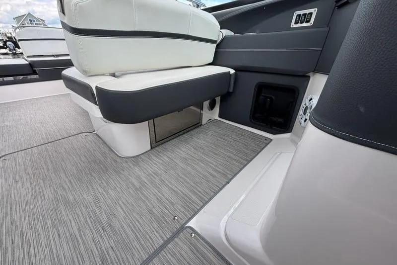 Slide: The Image of Interior of a 2015 Regal 2800 Bowrider boat, featuring sleek seating and modern design. - 13