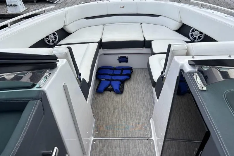Slide: The Image of 2015 Regal 2800 Bowrider interior with white seating and blue life jacket. - 3