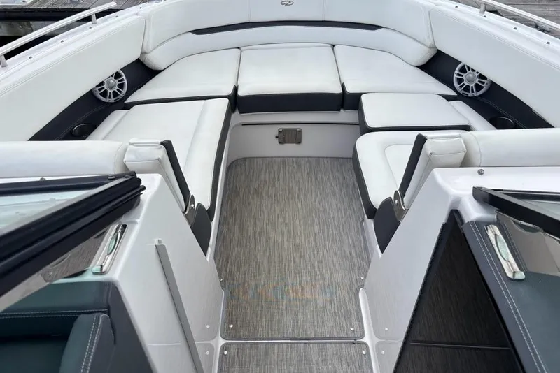 Slide: The Image of 2015 Regal 2800 Bowrider interior with white seating and modern design. - 4
