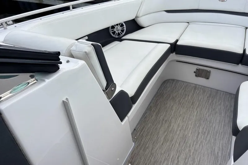 Slide: The Image of 2015 Regal 2800 Bowrider interior with white cushioned seating and sleek design. - 5