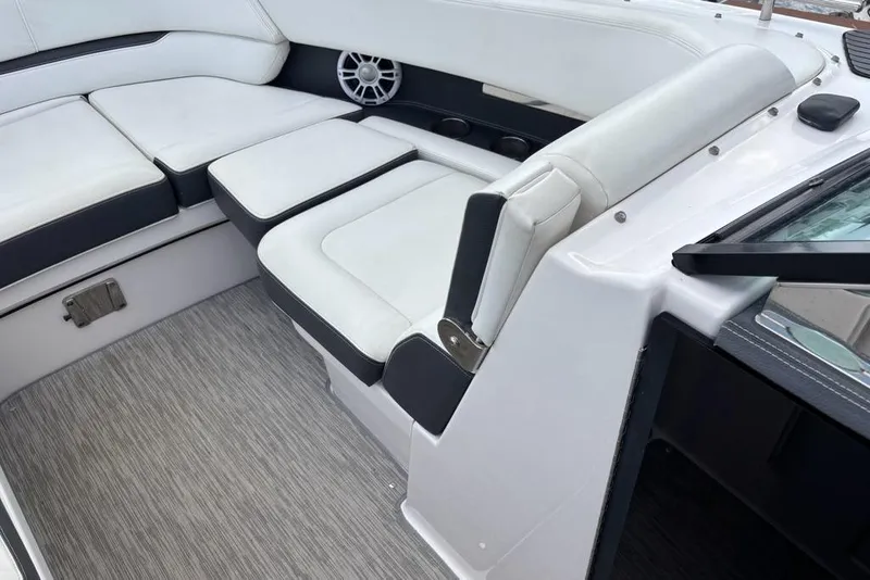 Slide: The Image of 2015 Regal 2800 Bowrider interior with white cushioned seating and modern design. - 6