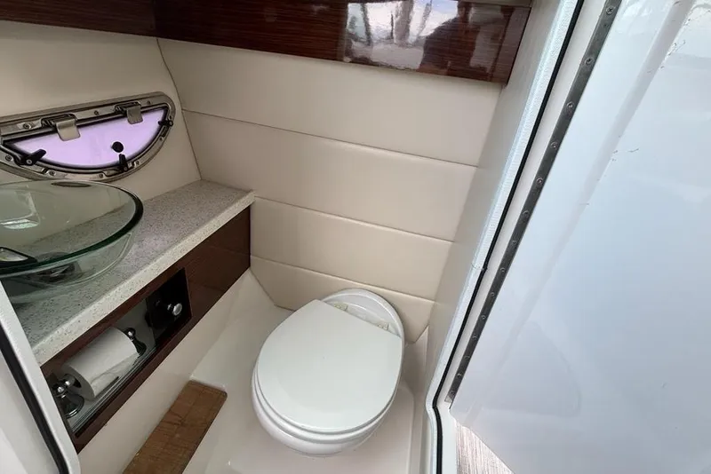Slide: The Image of Luxurious 2015 Regal 2800 Bowrider boat bathroom with modern fixtures and elegant design. - 7