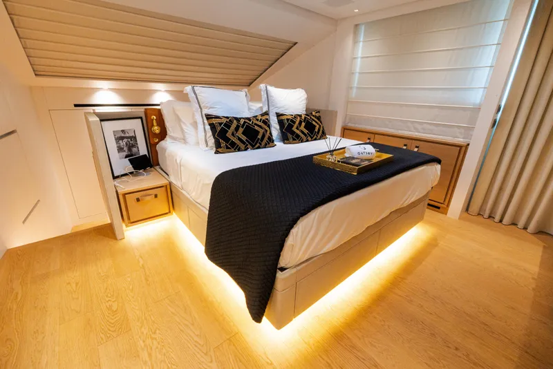 Slide: The Image of Luxurious bedroom interior on 2021 Sanlorenzo SL96 yacht, featuring elegant decor and ambient lighting. - 10