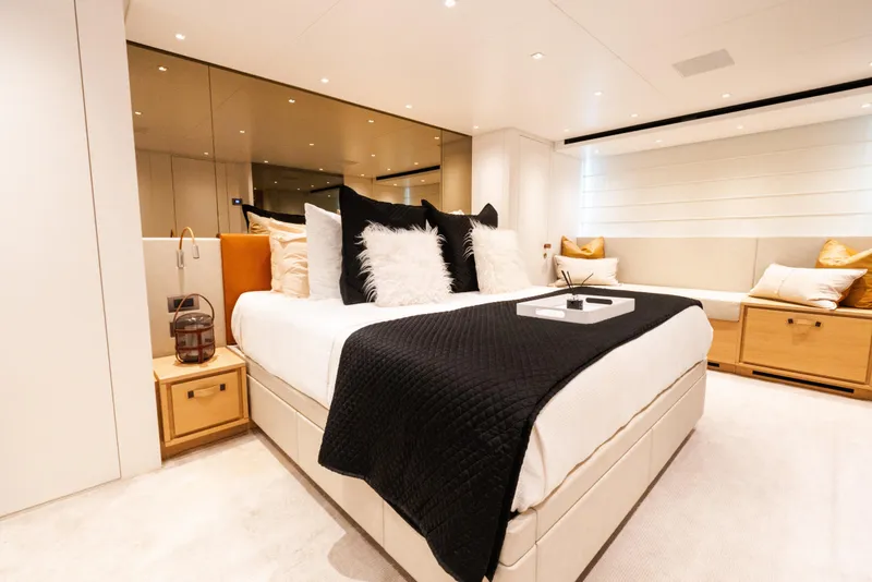 Slide: The Image of Luxurious bedroom interior on 2021 Sanlorenzo SL96 yacht, featuring elegant decor and plush bedding. - 18