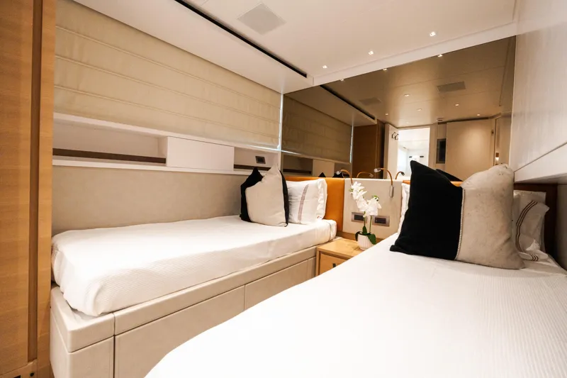 Slide: The Image of Luxurious twin cabin interior on 2021 Sanlorenzo SL96 yacht, featuring elegant bedding and decor. - 28