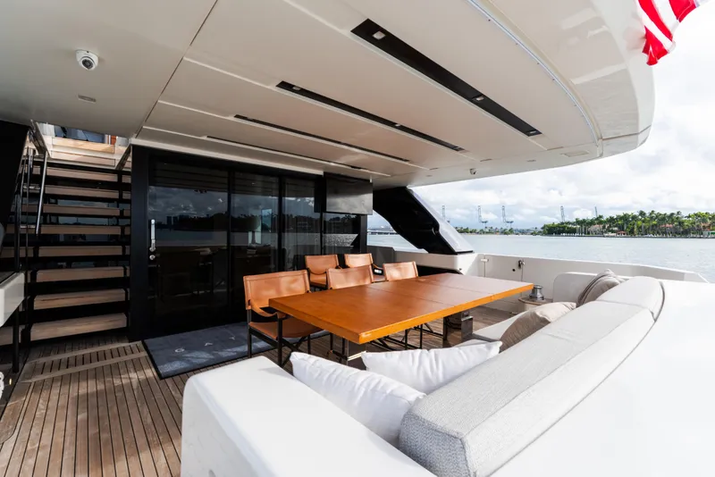 Slide: The Image of Luxurious 2021 Sanlorenzo SL96 yacht deck with dining area and scenic ocean view. - 32