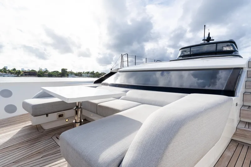 Slide: The Image of Luxurious 2021 Sanlorenzo SL96 yacht deck with modern seating and table, under cloudy sky. - 35