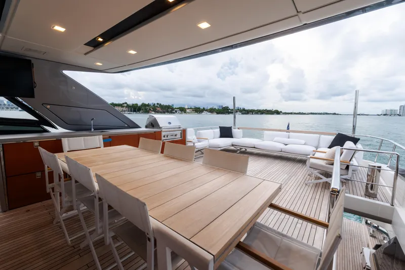Slide: The Image of Luxurious 2021 Sanlorenzo SL96 yacht deck with dining area and ocean view. - 39