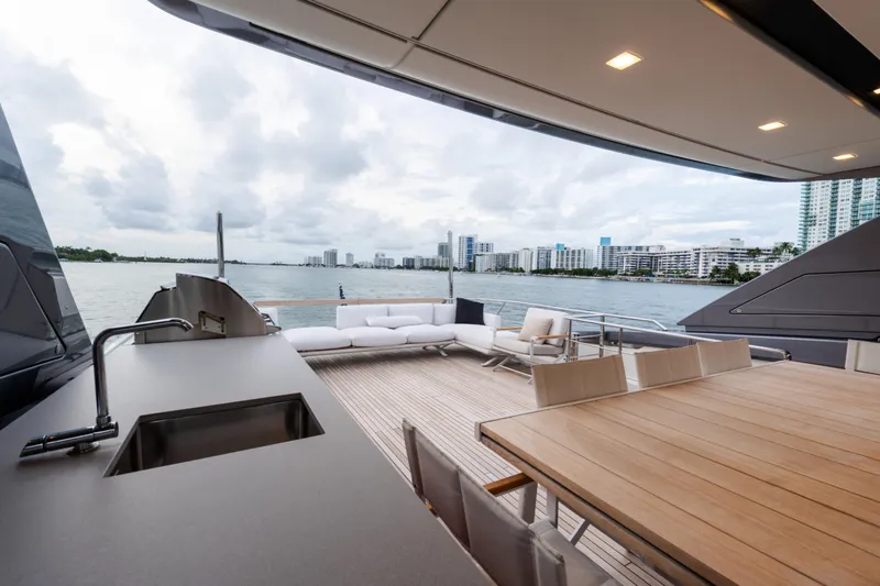 Slide: The Image of Luxurious 2021 Sanlorenzo SL96 yacht deck with seating, dining area, and ocean view. - 41