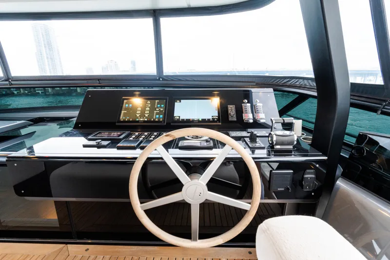 Slide: The Image of Helm of 2021 Sanlorenzo SL96 yacht with modern controls and panoramic view. - 43
