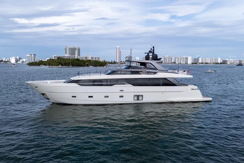 Slide: The Image of 2021 Sanlorenzo SL96 yacht cruising on a scenic waterfront with city skyline. - 52