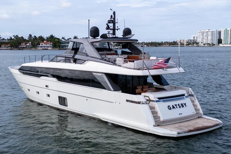 Slide: The Image of Luxury 2021 Sanlorenzo SL96 yacht on water, featuring sleek design and American flag. - 53