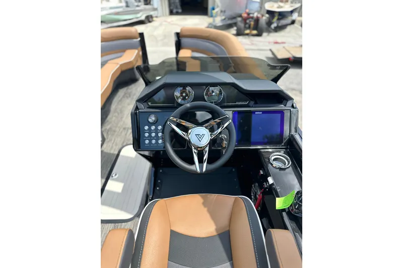 Slide: The Image of 2026 Viaggio Diamante 24 S boat dashboard with modern steering and digital display. - 21