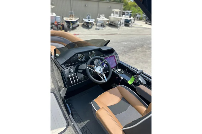 Slide: The Image of Viaggio Diamante 24 S 2026 boat dashboard with steering wheel and controls. - 22