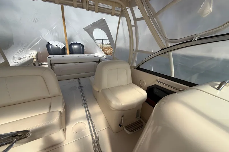 Slide: The Image of 2015 Grady-White Freedom 285 boat interior with white seating and covered deck. - 16