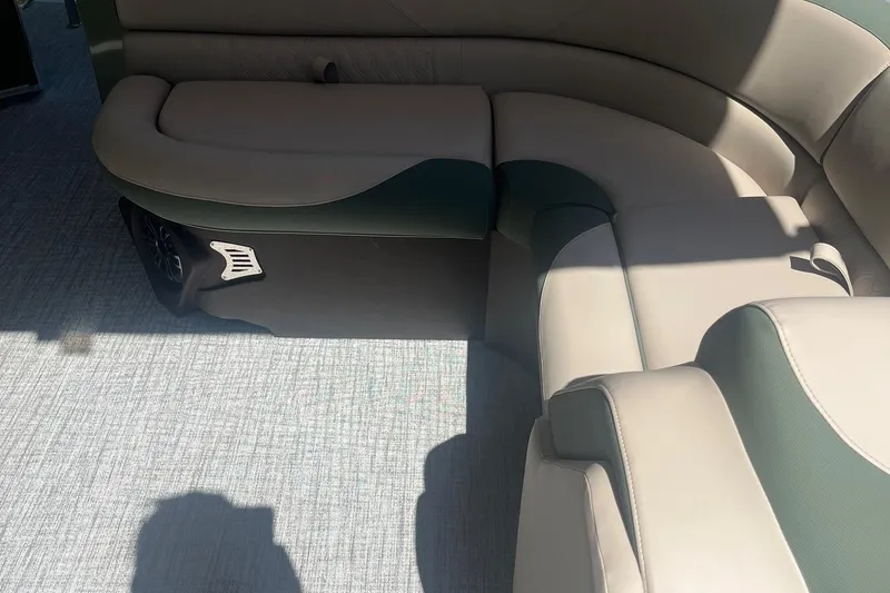 Slide: The Image of 2026 Avalon 21 LSZ Cruise boat interior with beige and green seating. - 5