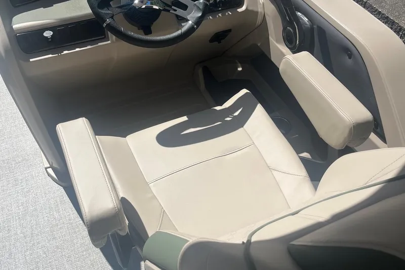 Slide: The Image of 2026 Avalon 21 LSZ Cruise boat interior with beige seating and steering wheel. - 6