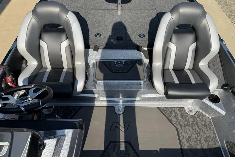 Slide: The Image of 2026 Nitro Z20 XL Pro boat interior with dual seats and steering wheel. - 11