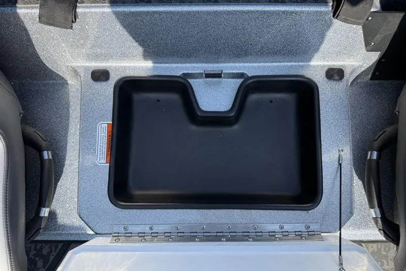 Slide: The Image of 2026 Nitro Z20 XL Pro boat storage compartment with black interior and gray exterior. - 16