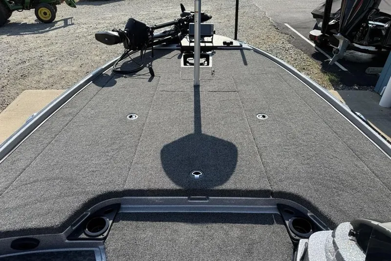 Slide: The Image of 2026 Nitro Z20 XL Pro boat deck with carpeted surface and fishing equipment. - 8