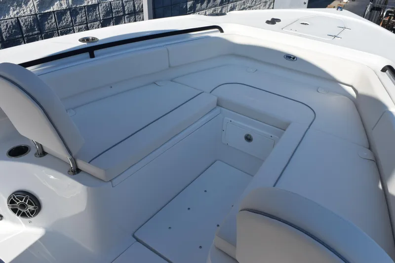 Slide: The Image of 2026 Sea Hunt Ultra 275 SE boat interior with cushioned seating and storage. - 12