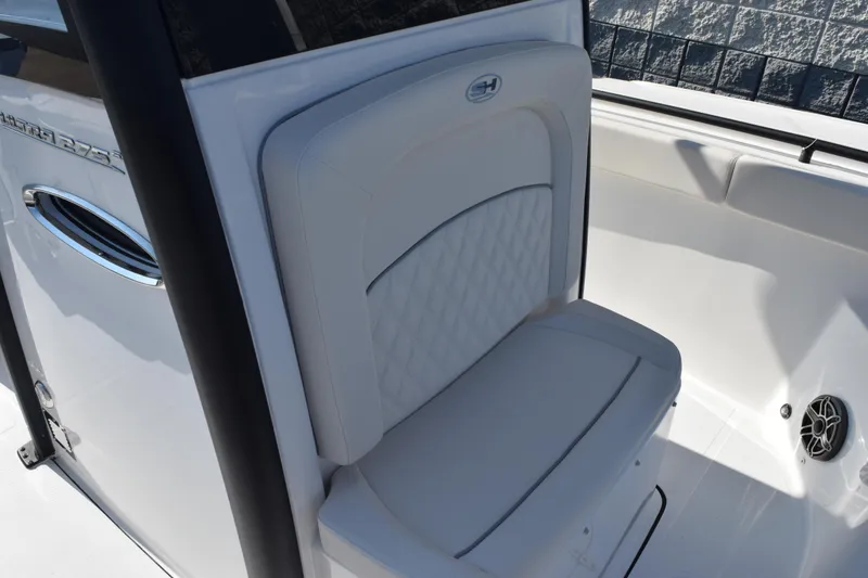 Slide: The Image of 2026 Sea Hunt Ultra 275 SE boat interior with cushioned seating and sleek design. - 13