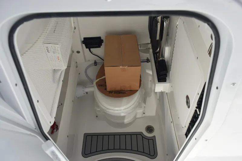 Slide: The Image of Interior of 2026 Sea Hunt Ultra 275 SE boat, featuring storage compartment. - 15
