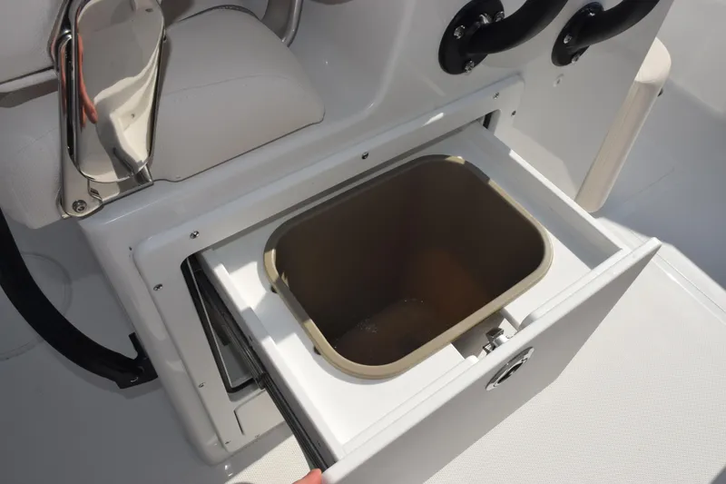 Slide: The Image of 2026 Sea Hunt Ultra 275 SE boat with open storage compartment. - 17