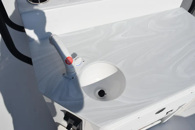Slide: The Image of 2026 Sea Hunt Ultra 275 SE boat sink and faucet detail. - 19