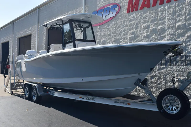 Slide: The Image of 2026 Sea Hunt Ultra 275 SE boat on trailer outside dealership. - 2