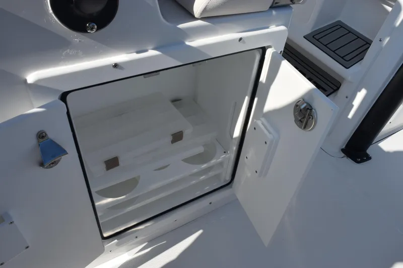 Slide: The Image of Open storage compartment on 2026 Sea Hunt Ultra 275 SE boat. - 22