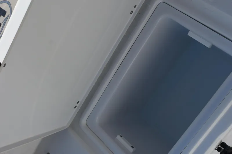Slide: The Image of Open storage compartment on 2026 Sea Hunt Ultra 275 SE boat. - 23