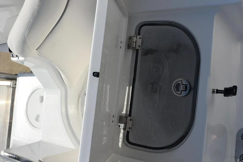 Slide: The Image of Interior view of 2026 Sea Hunt Ultra 275 SE boat with storage compartment. - 25