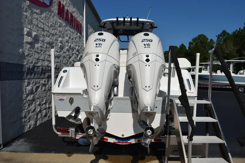 Slide: The Image of 2026 Sea Hunt Ultra 275 SE with twin 250 V6 engines, docked at marina. - 5