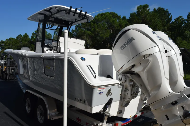 Slide: The Image of 2026 Sea Hunt Ultra 275 SE boat with dual Yamaha engines on a trailer. - 6