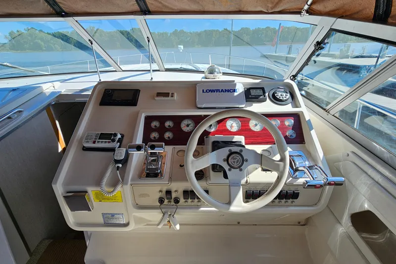Slide: The Image of Cockpit of 1995 Cruisers Yachts 3775 Esprit with steering wheel and navigation instruments. - 14