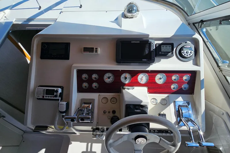 Slide: The Image of Control panel of a 1995 Cruisers Yachts 3775 Esprit with gauges and navigation equipment. - 15