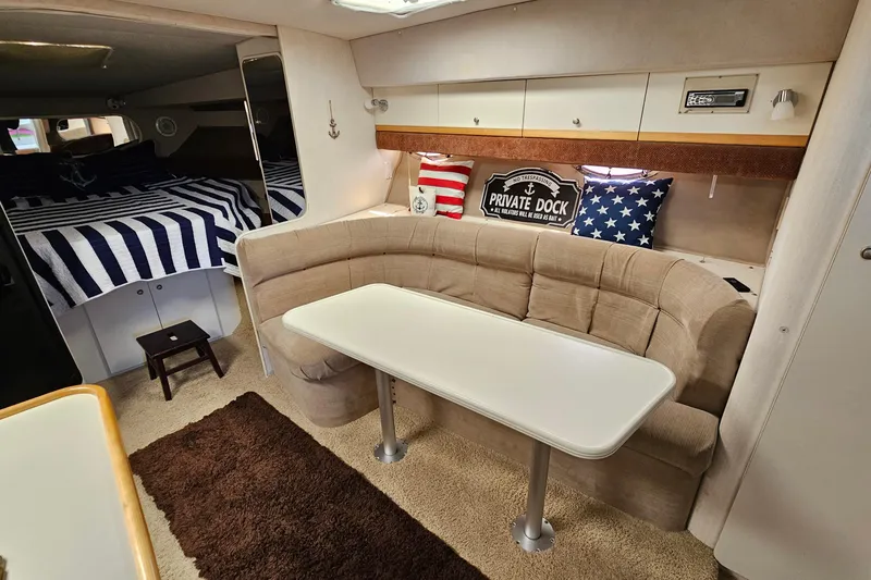 Slide: The Image of Interior of 1995 Cruisers Yachts 3775 Esprit with cozy seating and nautical decor. - 20