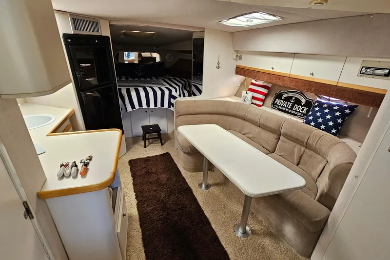 Slide: The Image of Interior of 1995 Cruisers Yachts 3775 Esprit with cozy seating and nautical decor. - 29