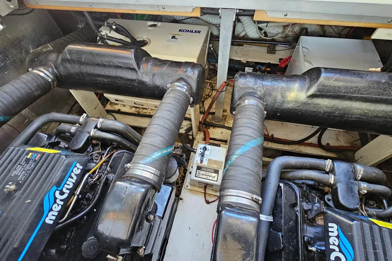 Slide: The Image of Engine compartment of 1995 Cruisers Yachts 3775 Esprit with MerCruiser engines and Kohler generator. - 33