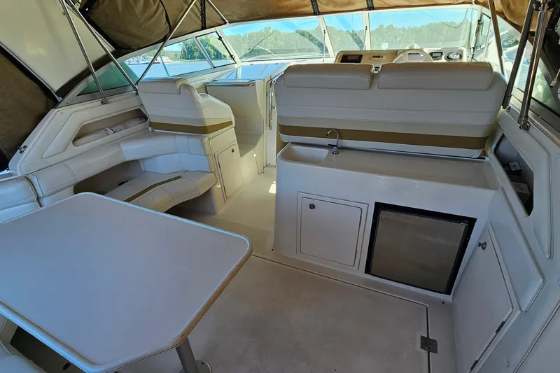Slide: The Image of 1995 Cruisers Yachts 3775 Esprit interior with seating, table, and helm station. - 7