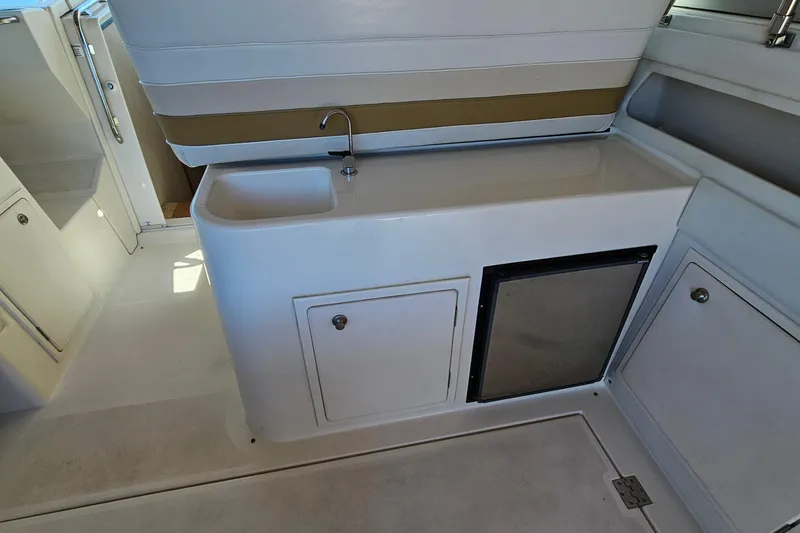 Slide: The Image of 1995 Cruisers Yachts 3775 Esprit interior with sink and storage area. - 8