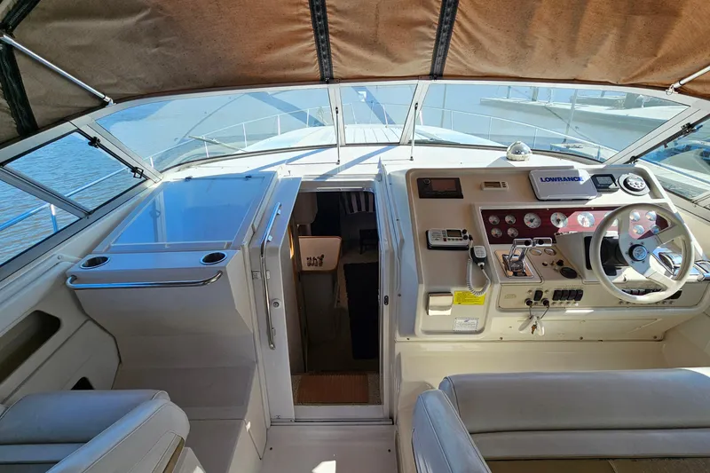 Slide: The Image of 1995 Cruisers Yachts 3775 Esprit cockpit with steering wheel and navigation equipment. - 12