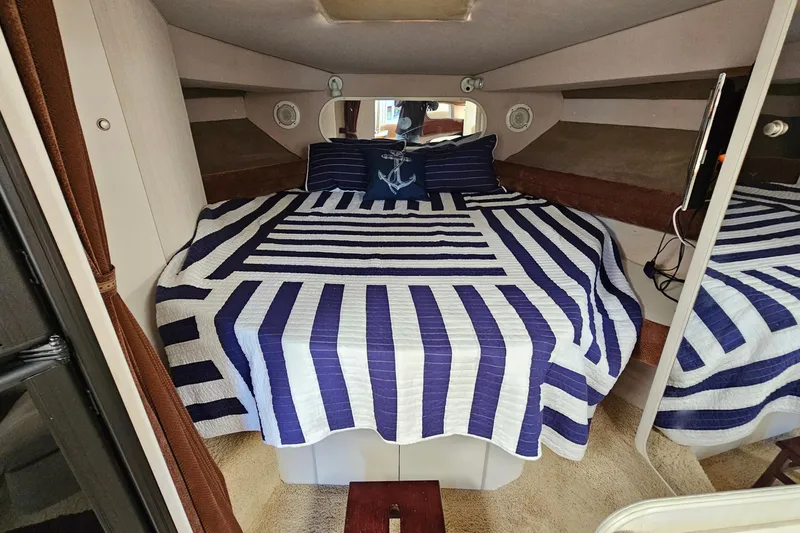 Slide: The Image of Interior cabin of 1995 Cruisers Yachts 3775 Esprit with striped bedding. - 24
