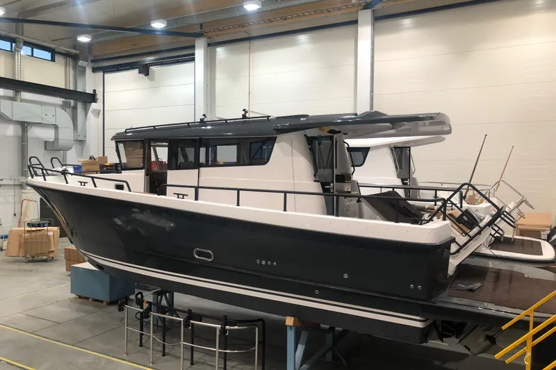 Slide: The Image of Cabin interior of 2019 Sargo 36 Explorer with twin beds and nautical decor. - 14