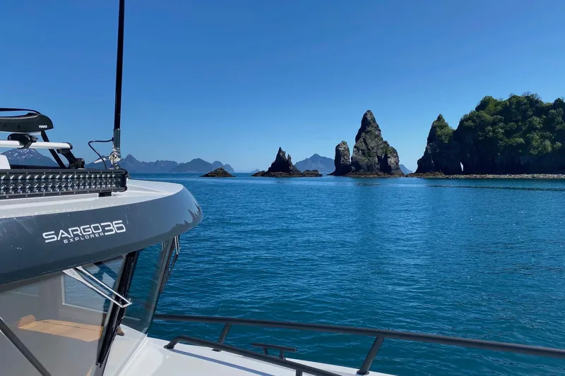 Slide: The Image of 2019 Sargo 36 Explorer cruising on water at sunset. - 2